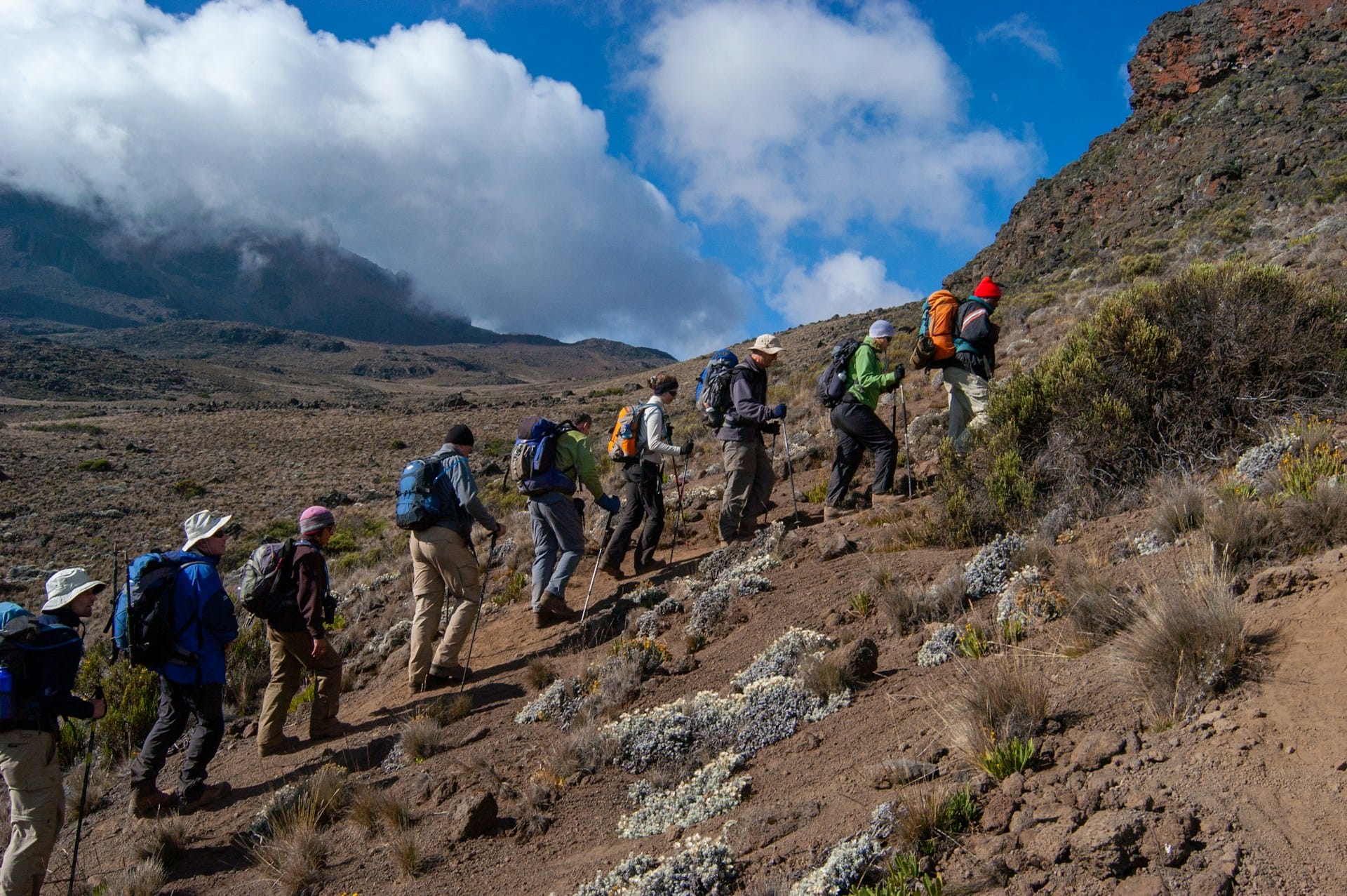 Traveler resting during Kilimanjaro trekking expedition