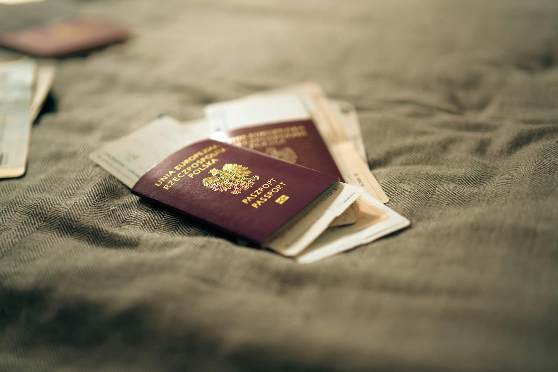 2 passport laying down with air tickets