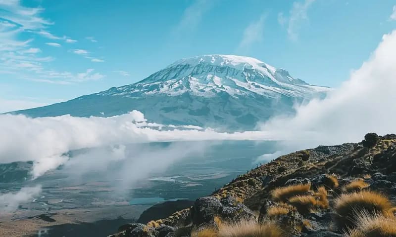 A view of the tallest mountain in Africa as you ascend on a 5-day Marangu Route climb